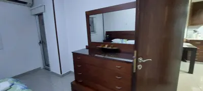 a bathroom with a wooden dresser with a mirror at D Pitsillos Homes in Larnaka