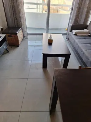 a living room with a couch and a coffee table at D Pitsillos Homes in Larnaka