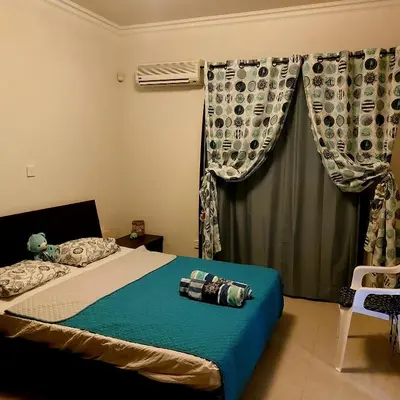 a bedroom with a bed and a window at Danitsea villa with privat pool in Psematismenos