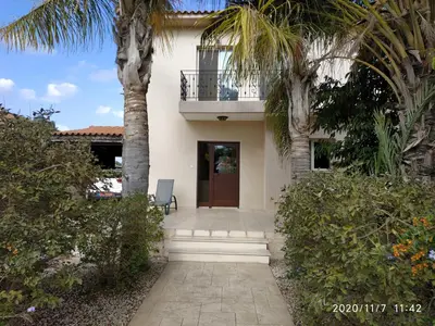 a house with palm trees and a walkway at Danitsea villa with privat pool in Psematismenos