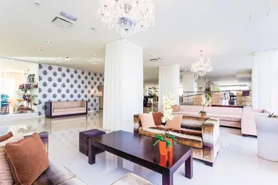 a living room with a couch and a coffee table at Vrissiana Boutique Beach Hotel in Protaras