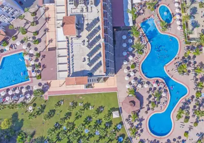 an overhead view of a pool at a resort at Tsokkos Gardens Hotel in Protaras