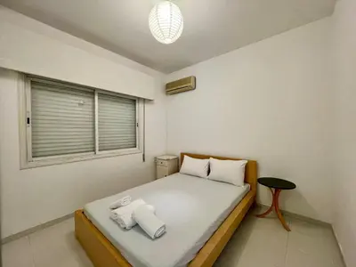 a small bedroom with a bed and a window at Central Comfort in Nicosia - Orfeos By Platform 357 in Nicosia
