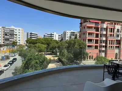 a view of a city street from a balcony at WealthyStays Parkside Residence in Nicosia
