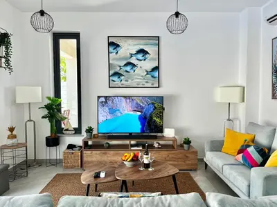 a living room with a tv and a couch at STAY Villa Palm in Protaras