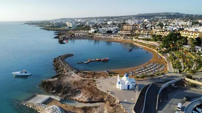 an aerial view of a beach with a boat in the water at STAY Villa Palm in Protaras
