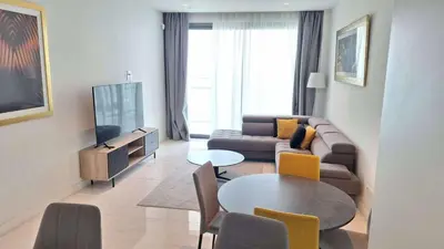 a living room with a couch and a table at Del Mar 2 bedroom Seaside 'A' Residence in Limassol