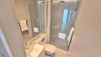 a bathroom with a shower and a toilet and a sink at Del Mar 2 bedroom Seaside 'A' Residence in Limassol