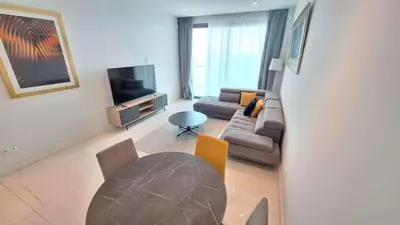 a living room with a couch and a table at Del Mar 2 bedroom Seaside 'A' Residence in Limassol