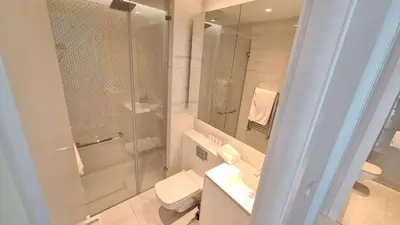 a bathroom with a shower and a toilet and a sink at Del Mar 2 bedroom Seaside 'A' Residence in Limassol