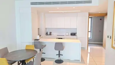 a kitchen with a table and chairs in a room at Del Mar 2 bedroom Seaside 'A' Residence in Limassol