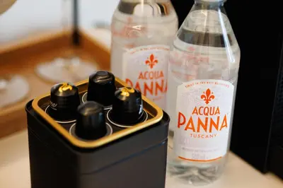 two bottles of vodka sitting on top of a table at The Palm Suites - Adults Only in Limassol