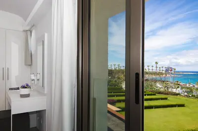 a room with a window with a view of the ocean at Apartment Josephine - Beachfront in Protaras