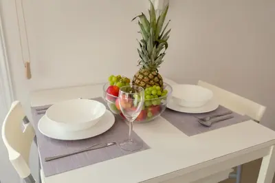 a table with a pineapple and a bowl of fruit at Obv 2304 in Pyla