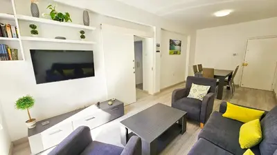 a living room with a couch and a table at Blue Sky Ocean Retreat in Larnaka