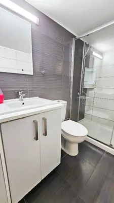 a bathroom with a toilet and a sink and a shower at Blue Sky Ocean Retreat in Larnaka