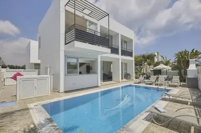 a villa with a swimming pool and a house at Protaras Pearl Villa Pe15 in Protaras