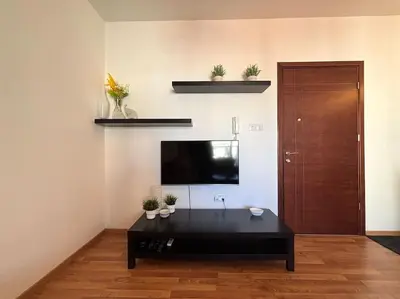 a living room with a tv and a black coffee table at One Bedroom Flat in Central Nicosia in Nicosia