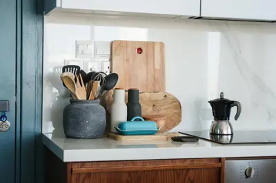 a kitchen counter with utensils on a counter top at Penthouse Living in the Heart of Nicosia in Nicosia