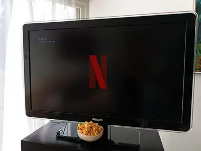 a computer monitor on a desk with a bowl of popcorn at Sea view Beach House with Pool in Limassol