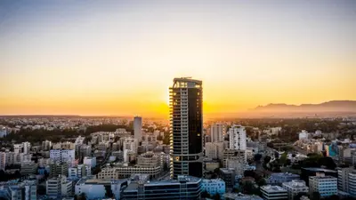 a view of a city with a tall building at 360 Sky Residence, Gym & Pool - 26th Floor in Nicosia