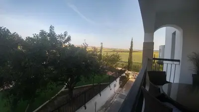 a balcony of a house with a view of a field at Emerald Heights in Tersephanou