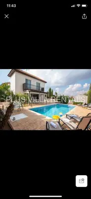 a picture of a swimming pool with chairs and a house at Villa 4 Ayia Thekla in Ayia Napa