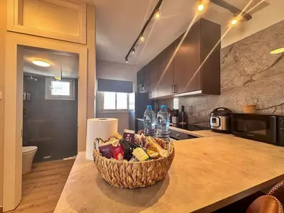 a basket of food on a counter in a kitchen at Beautiful One Bedroom Apartment 100 Meters from the Beach, Recently Renovated in Limassol