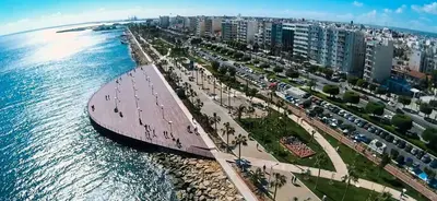 an aerial view of a city next to the ocean at Diana Apartment in Limassol