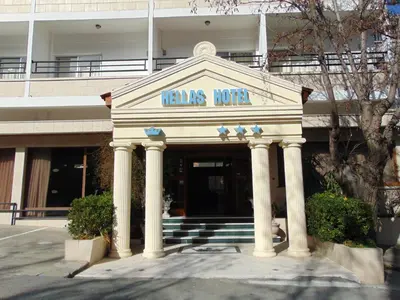 a building with a sign that reads nannas hotel at Hellas Hotel in Kakopetria