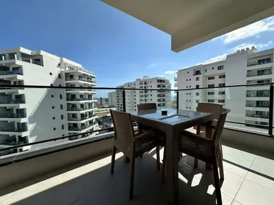 a table and chairs on a balcony with a view at Your place for relax in Larnaka