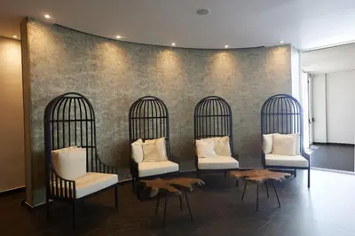 a group of four birdcages with white pillows at The HEALTHY Stay-Padel, Pool&Fitness in Ayia Napa