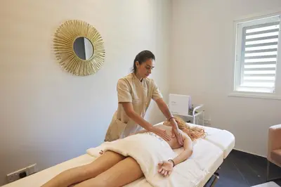 a woman getting a massage on a patient at The HEALTHY Stay-Padel, Pool&Fitness in Ayia Napa