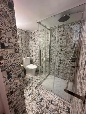 a bathroom with a shower and a toilet at Joanna's Rooms in Kalopanayiotis