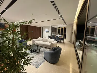 a living room with a couch and a table at WealthyStays 360 Luxury Residence in Nicosia