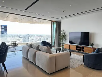 a living room with a couch and a flat screen tv at WealthyStays 360 Luxury Residence in Nicosia
