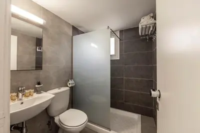 a bathroom with a toilet and a sink and a shower at Somantonia apartments in Protaras