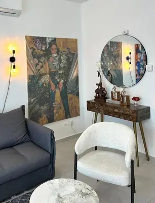 a living room with a couch and a mirror at -Mari- Cozy Stay at Engomi Near UNIC in Nicosia
