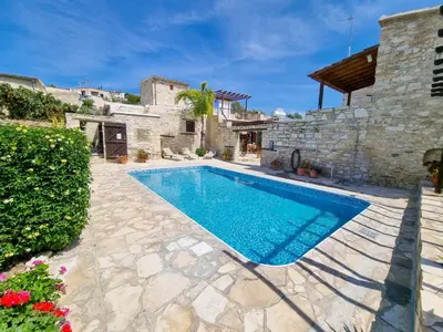 a swimming pool in a yard with a house at Skarinou Panorama Room in Skarinou