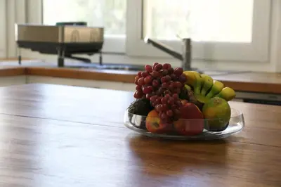 a bowl of fruit sitting on top of a table at Freshness Modern 2 Bedroom Apartment with Balcony & Stunning Sea View in Central Limassol in Limassol