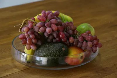 a bowl of fruit sitting on top of a table at Freshness Modern 2 Bedroom Apartment with Balcony & Stunning Sea View in Central Limassol in Limassol