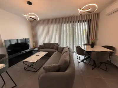 a living room with a couch and a table at Glabur Stays - Nicosia Elite 2BDR in Nicosia