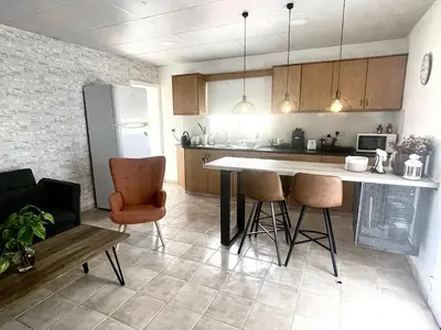 a kitchen with a table and chairs in a room at Cosy Refurbished Apt City Centre in Limassol