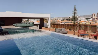 a swimming pool on the roof of a house at Alinea Lano Old Town Center in Limassol