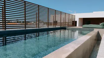 a swimming pool in the middle of a house at Alinea Lano Old Town Center in Limassol