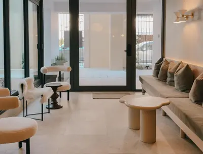 a living room with a couch and tables and chairs at Alinea Lano Old Town Center in Limassol