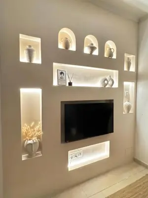 a living room with a flat screen tv on a wall at Bohemian Oasis in Episkopi Lemesou