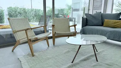 a living room with two chairs and a coffee table at TooCoool Villa - Azure Seaview in Protaras