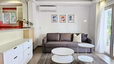 a living room with a couch and a table at Phaedrus Living Limassol Ocean Pearl Residence in Limassol
