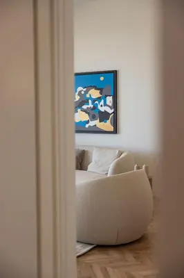 a living room with a couch and a painting on the wall at Interlace by Holistays in Engomi